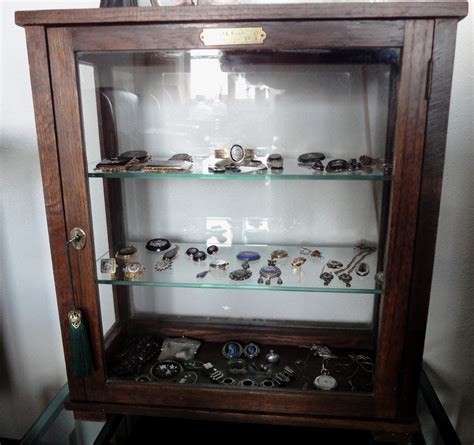 Antique antique dark oak display cabinet | Collectors Weekly