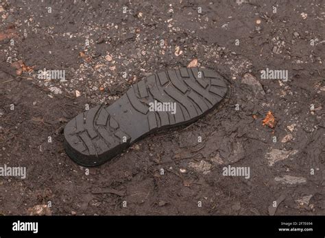 Underside Of A Shoe Tread Visible That It Fell Off And Is Now Stuck In
