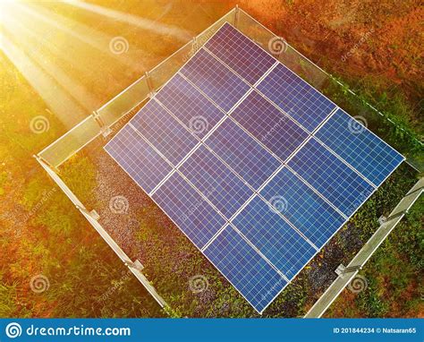 Solar Panels Against The Sunshine Bright Sunny Day Solar Farm In Rural Eco Environmentally