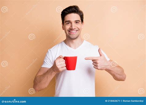 Portrait Of Optimistic Brunet Man Point Cup Wear White T Shirt Isolated