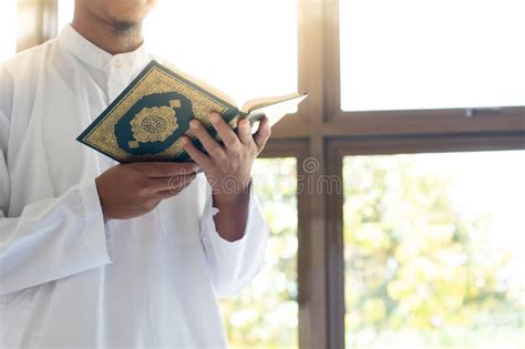 Muslim Man Reading Holy Quran Holy Quran In Hand With Arabic Text