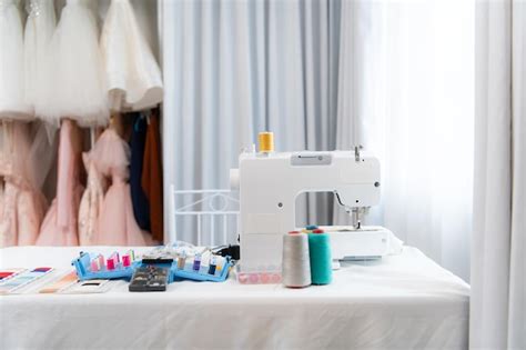 Premium Photo Sewing Machine And Accessories On The Table For The
