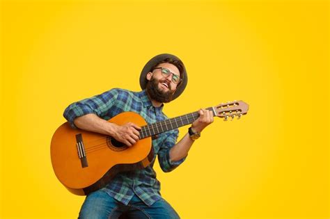 Premium Photo Bearded Man Playing Guitar