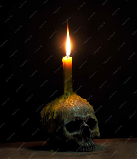 Premium Photo Light The Candle On Skull