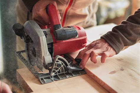 Carpenter Using Circular Saw By Stocksy Contributor Pixel Stories