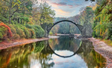 Fabulous Autumn Landscape in Azalea and Rhododendron Park Kromlau. Rakotz Bridge Rakotzbrucke ...