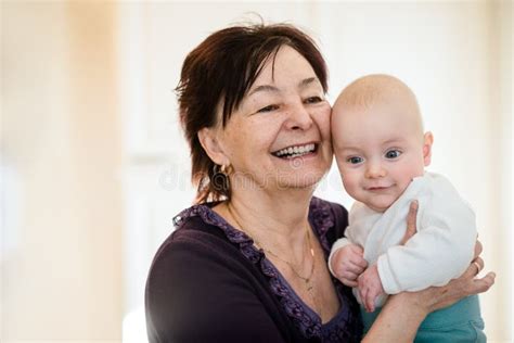 Grandmother With Grandson Hugging Stock Image Image Of Home Candid