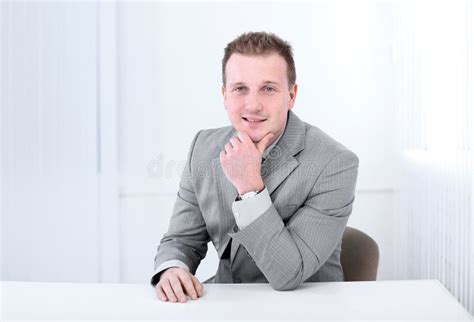 Successful Businessman Sitting Behind A Desk Stock Photo Image Of