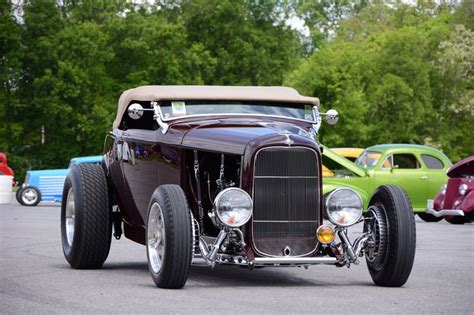 An Antique Car Is Parked In A Parking Lot