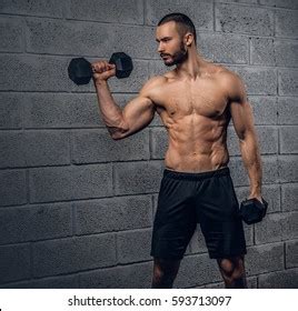 Shirtless Athletic Bearded Male Doing Workouts Stock Photo 593713097