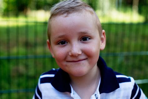 Selective Focus Portrait Photo of Smiling Boy · Free Stock Photo