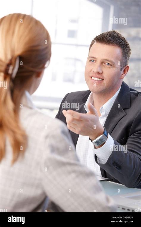 Male Manager Interviewing Female Candidate Smiling Stock Photo Alamy