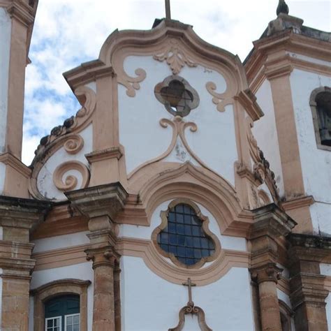 An Old Church With Two Towers And Arched Windows