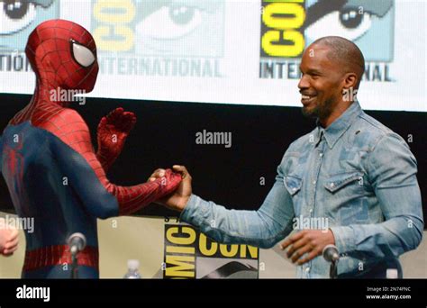 Spider-Man, left, and Jamie Foxx attend the "The Amazing Spider-Man 2" panel on Day 3 of Comic ...