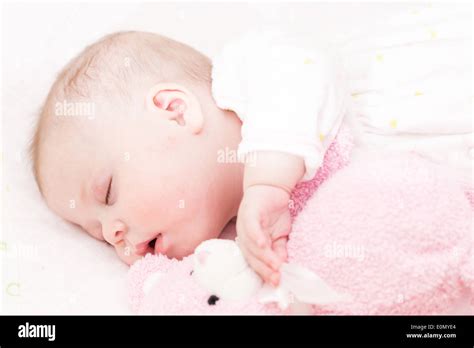 Cute Baby Girl Sleeping In Her Crib Stock Photo Alamy