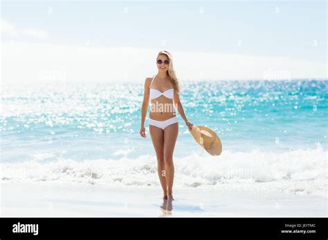 Woman In Bikini Walking On Beach Stock Photo Alamy