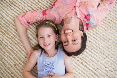 Premium Photo Mother And Daughter Smiling At Camera