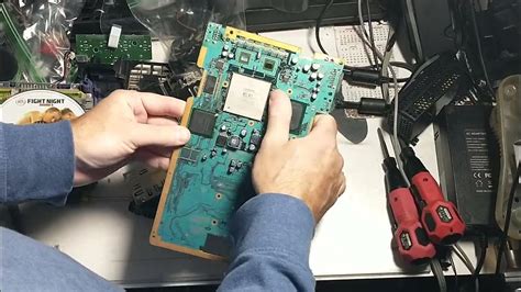 Pulling A Gh 023 Motherboard From A Ps2 50001 And Drive Assembly Tear