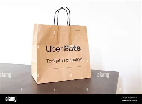 Uber Eats Paper Delivery Bag On Dining Table Stock Photo Alamy