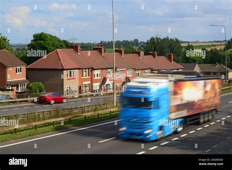 Busy Traffic On A1 M Motorway Passing Close To Houses At Skellow