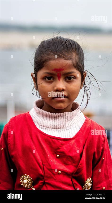 Kid On A Ghat Close To The Ganges River Varanasi Uttar Pradesh India