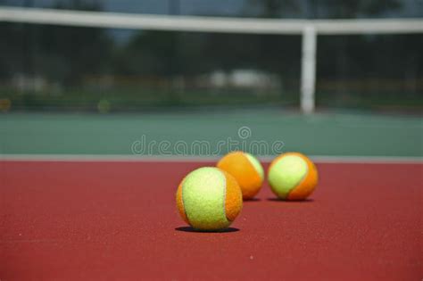 Multi Colored Tennis Balls On Hard Court Stock Image Image Of Lime