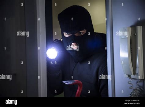 Thief Entering Into House Stock Photo Alamy