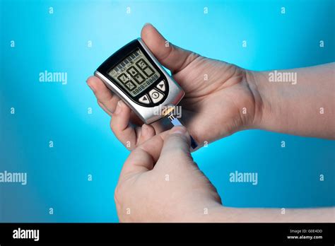 Blood glucose meter to check the blood sugar level Stock Photo - Alamy