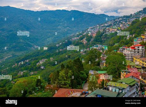 An Aerial Of Gangtok Blue Misty Mountains And Cloudy Sky In The