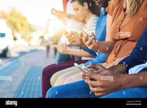 Everyone On Their Phones A Group Unrecognizable People Using Their