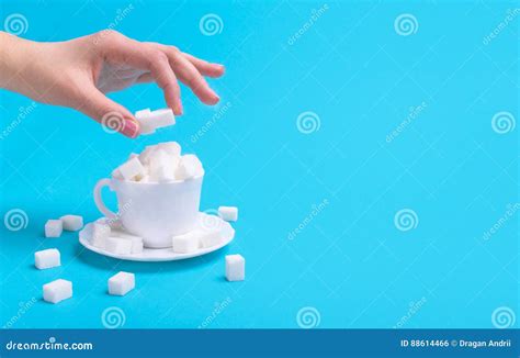 Lot Of Sugar In A Cup Hand Putting A Sugar Cube Stock Photo Image Of