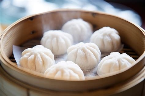 Premium Photo Close Up Of Freshly Steamed Dumplings In A Bamboo