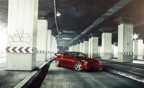 Modified Red Nissan 350Z Driving Low — CARiD.com Gallery