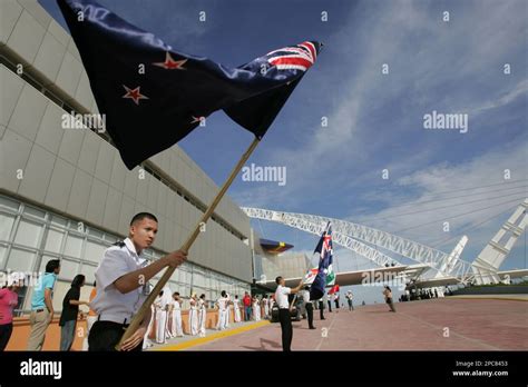 Students Wave National Flags Of The Member Association Of Southeast