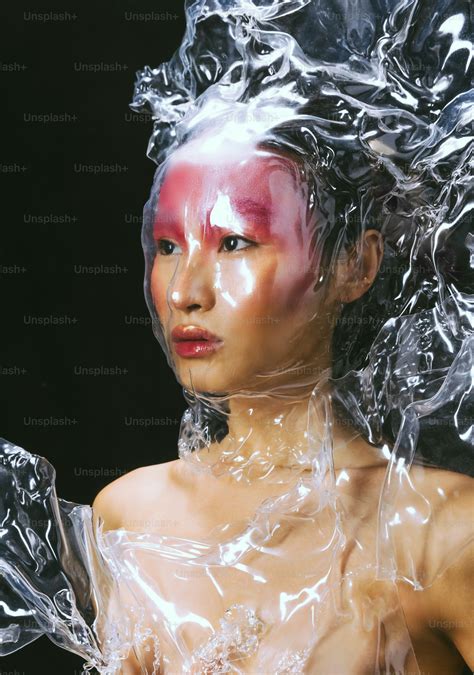 A woman is wrapped in plastic for a fashion shoot. photo – Abstract