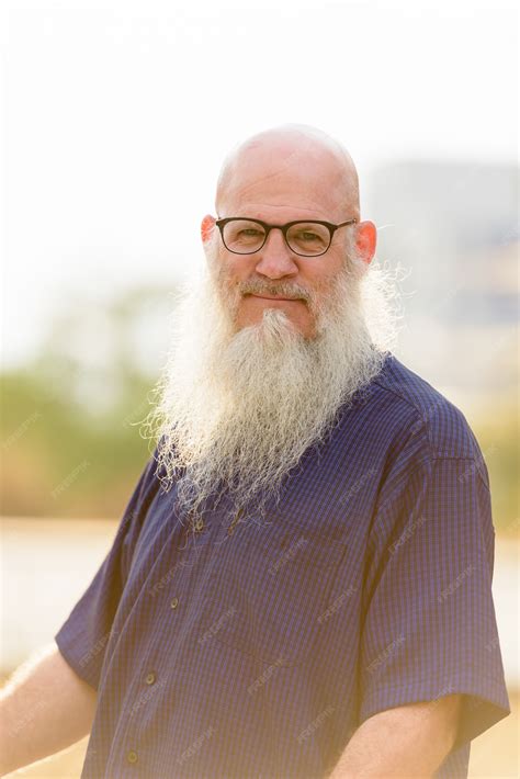 Premium Photo Portrait Of Mature Bald Bearded Man With Eyeglasses