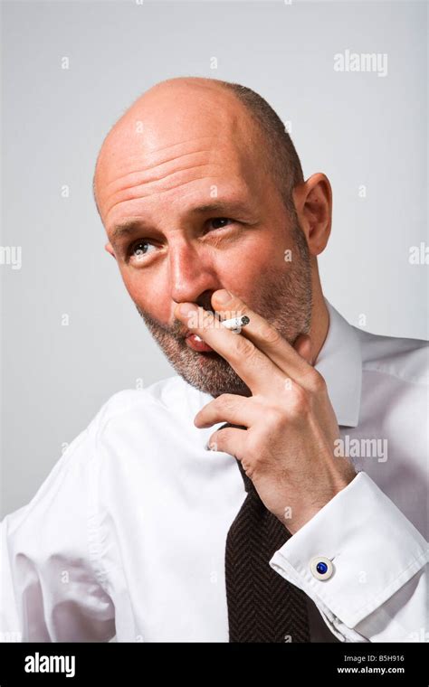 Man Smoking A Cigarette Indoors Hi Res Stock Photography And Images Alamy