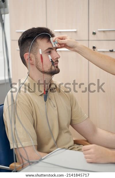 Young Man During Electromyography Procedure Clinic Stock Photo 2141845717 | Shutterstock