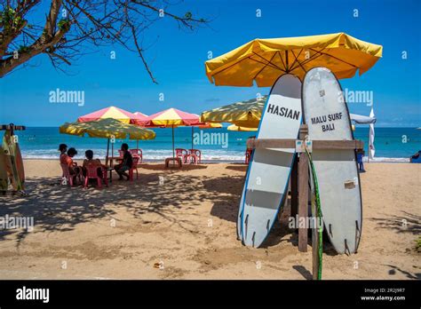 View Of Sunshades And Surf Boards On Sunny Morning On Kuta Beach Kuta