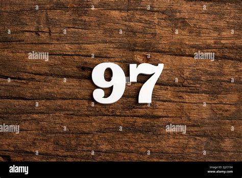 Number 97 Piece On Rustic Wood Background Stock Photo Alamy