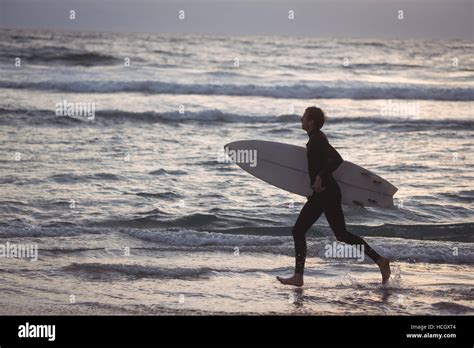 Man Carrying Surfboard Hi Res Stock Photography And Images Alamy