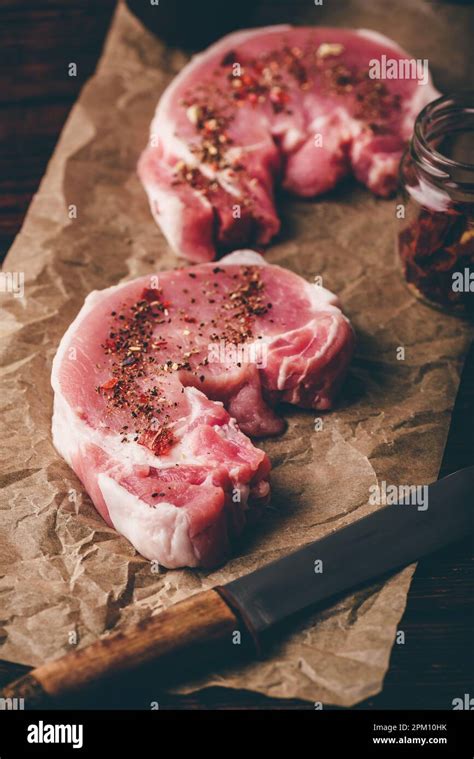 Pork Loin Steaks With Ground Spices On Baking Paper Stock Photo Alamy