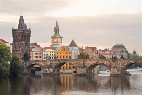 Premium Photo Stone Bridge With The Tower And River In A Beautiful