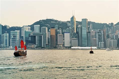 Premium Photo Junk Boat At The Victoria Harbor Of Hong Kong At Sunset