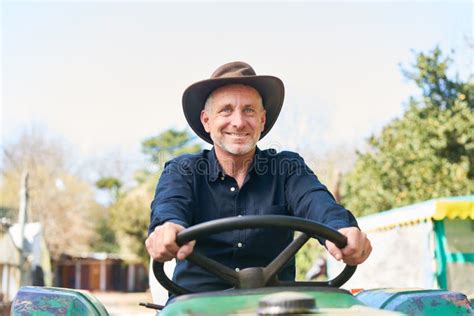 Smiling Farmer Driving Tractor At Farm Stock Photo Image Of Vehicle