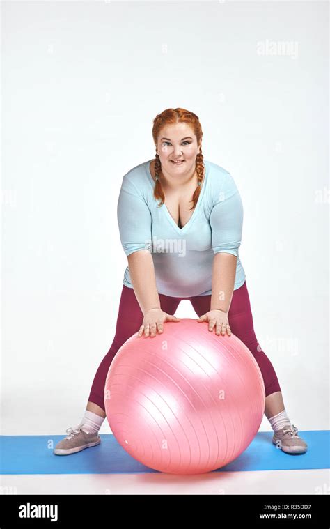 Funny Picture Of Amusing Red Haired Chubby Woman Which Is Holding A