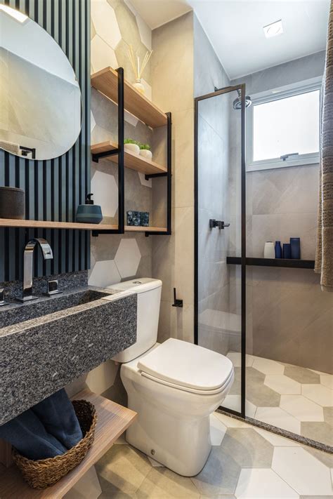 A Bathroom With A Toilet Sink And Shower Stall Is Shown In This Image