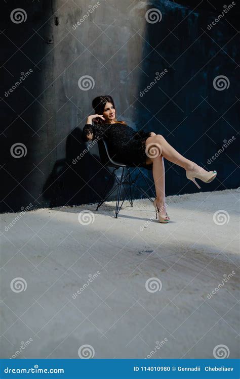 Brunette Posing Near Black Wall In The Studio Stock Photo Image Of