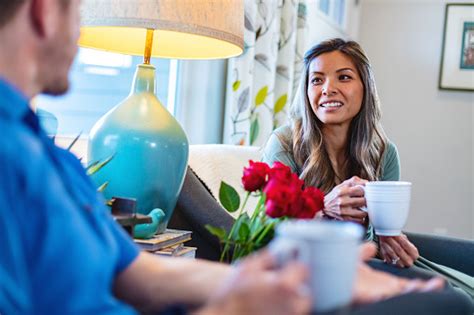 Spring Seasonal Lifestyle Multiracial Millennial Couple In Modern Home