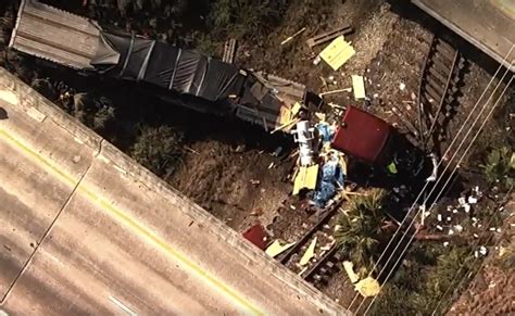 Truck Driver Dies After Semi Truck Flies Off Overpass